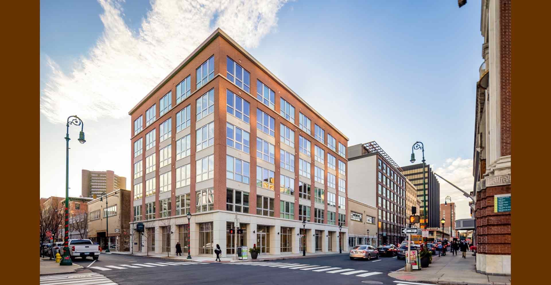 The completed mixed-use building now standing at 808 Chapel Street.
