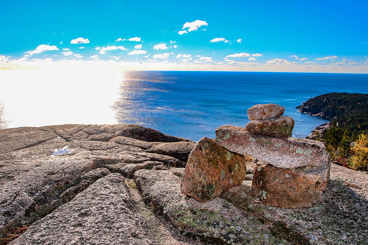 A carefully arranged rock cairn overlooking the ocean from Gorham Mountain in Acadia National Park.